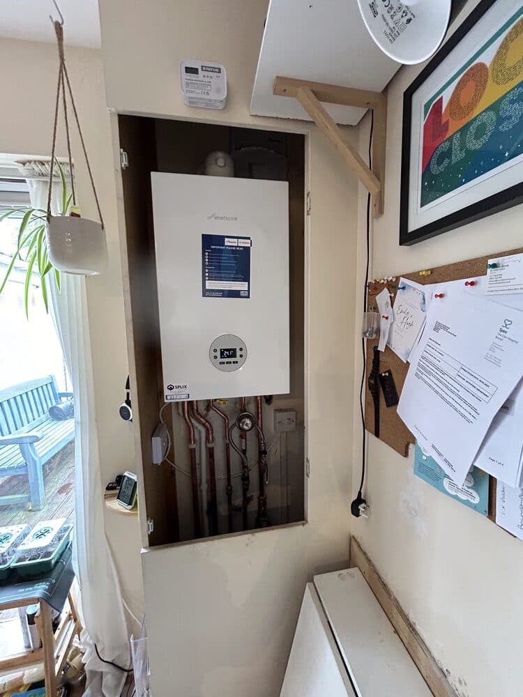 New boiler installed with tidy pipework in a utility space