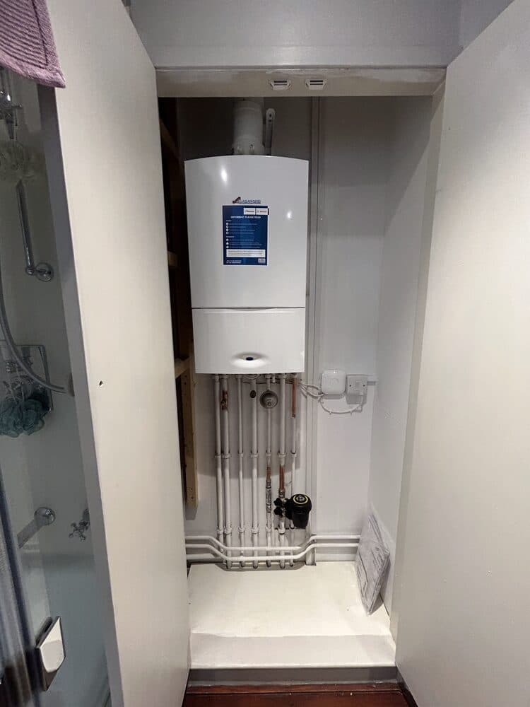 New boiler fitted in an alcove with neat pipework