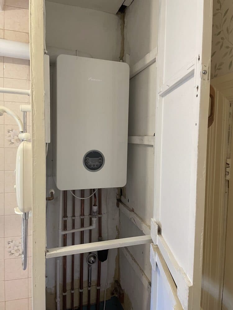 New combi boiler installed with a white door surround