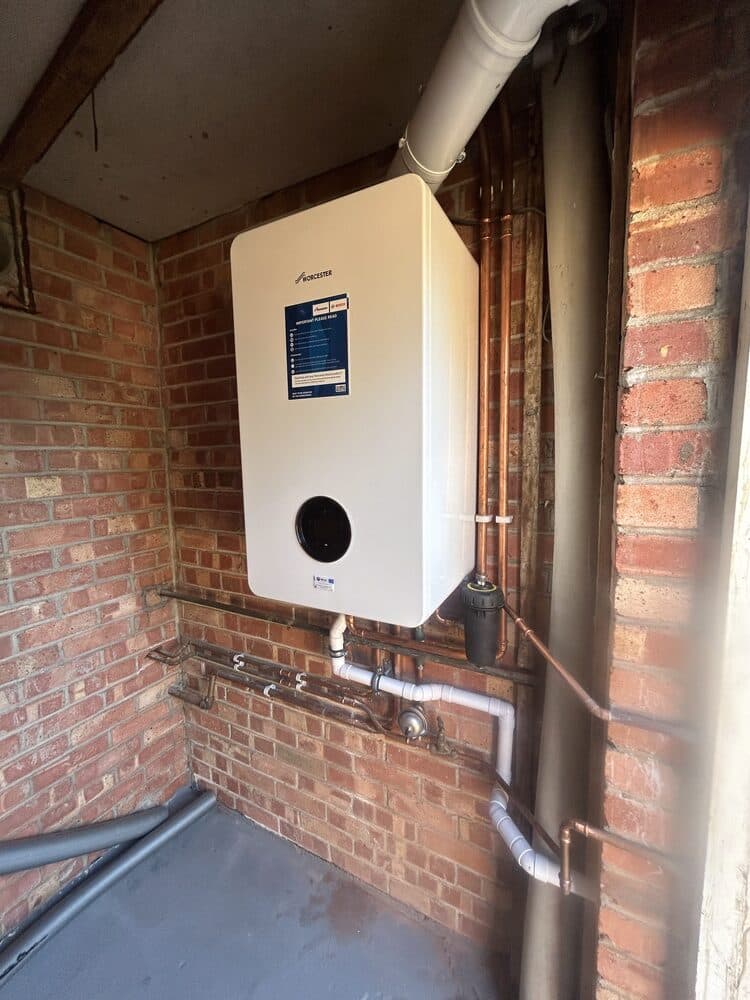 New boiler installed against an exposed brick wall