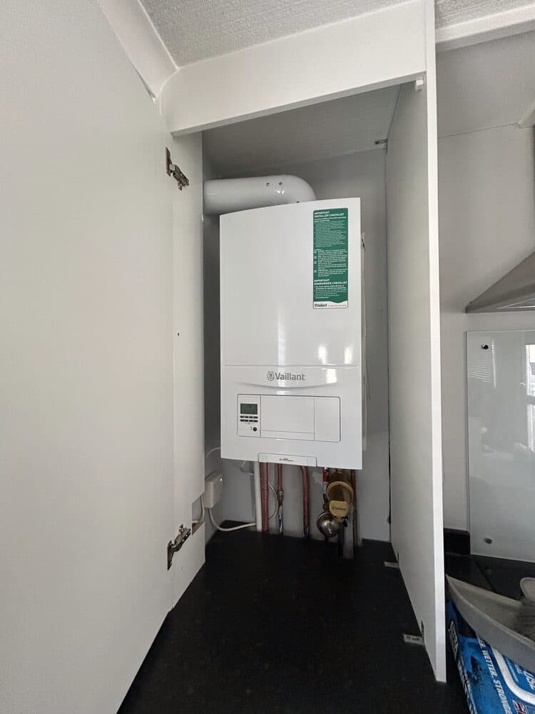 Combustion analyser connected to a boiler during an annual service