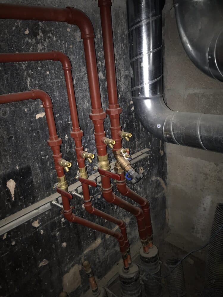 Commercial pipework installation with insulated runs