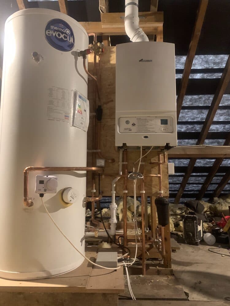 Cylinder and boiler installed in a loft space