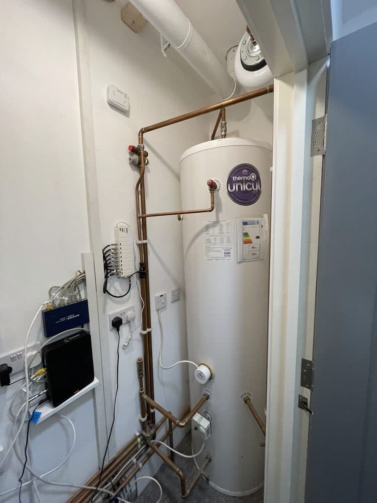 Telford hot water cylinder installed with copper pipework and controls