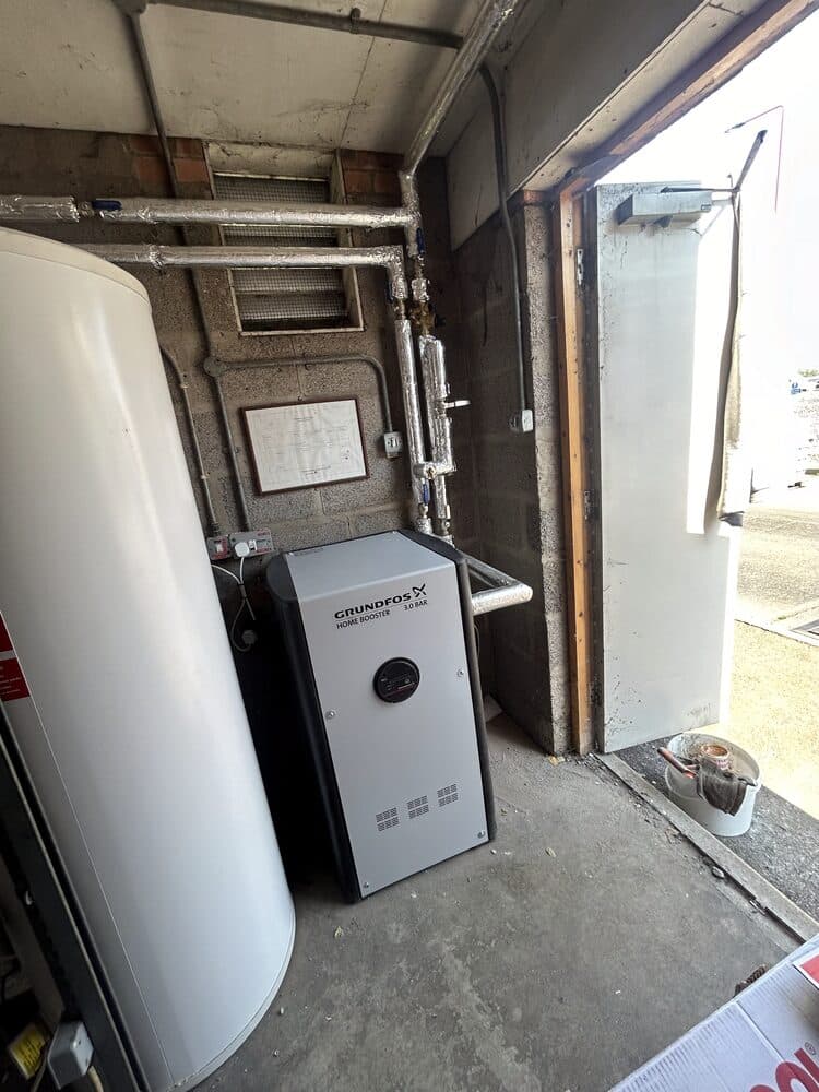Hot water cylinder and boiler installed in an outbuilding