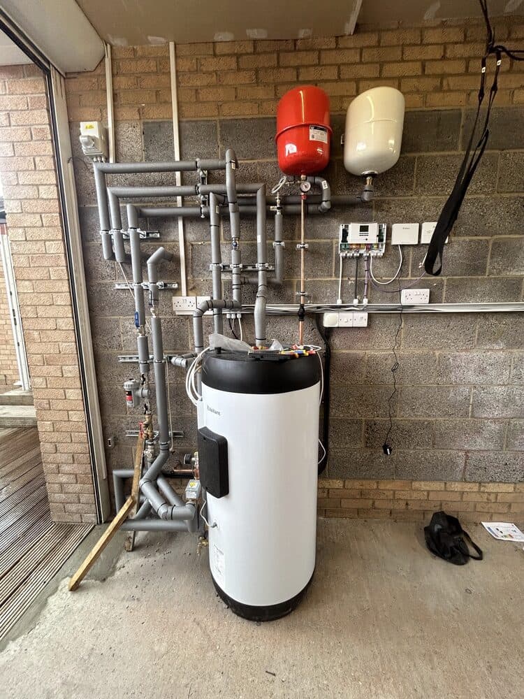 Unvented cylinder installed with pressure vessels in an outdoor plant space